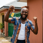 buy property in nigeria from uk showing an happy man with a key house pictured by ATLAS Realtors
