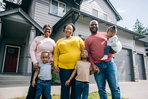 buy property in nigeria from usa showing a picture of a man with his family happy with their homes made by ATLAS Realtors